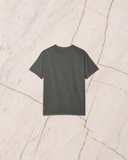 The back of the SISYPHUS shirt, plain pepper, laid on pale marble.